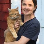 lady holding her indoor cat