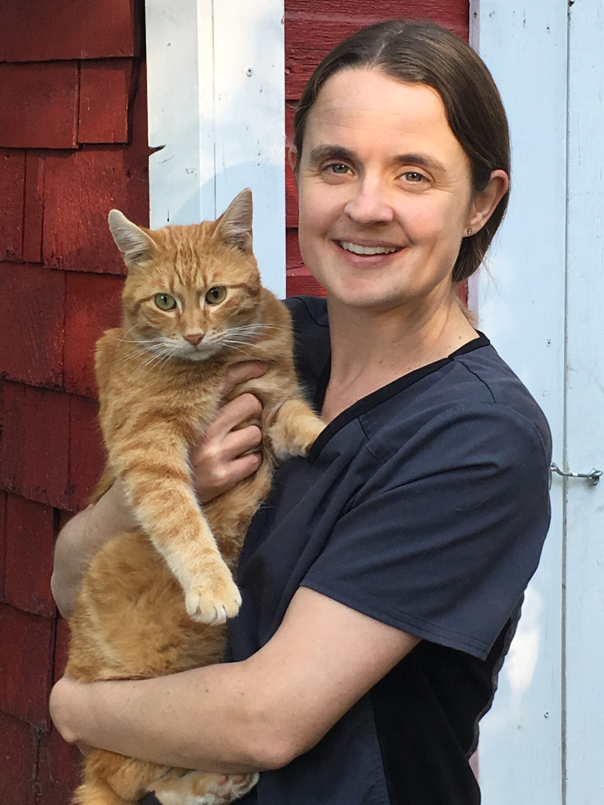 lady holding her indoor cat